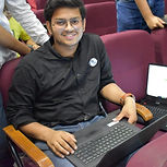 Photo of Rishabh Dhenkawat joyfully smiling for the camera
